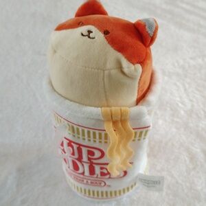 This is an Anirollz x Nissin Cup Noodles Foxiroll plush toy.